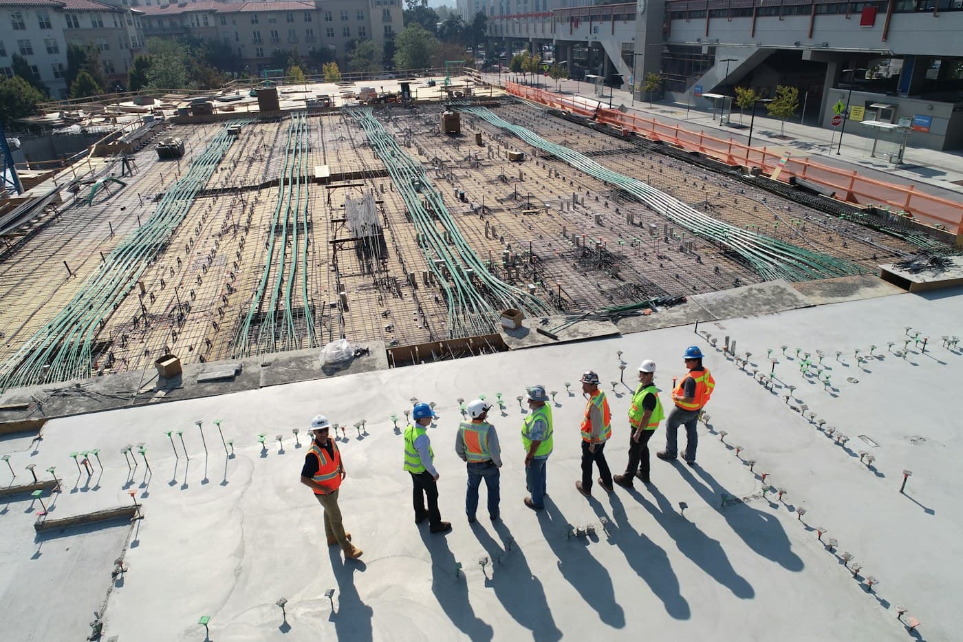 Experienced construction team reviewing an active project site